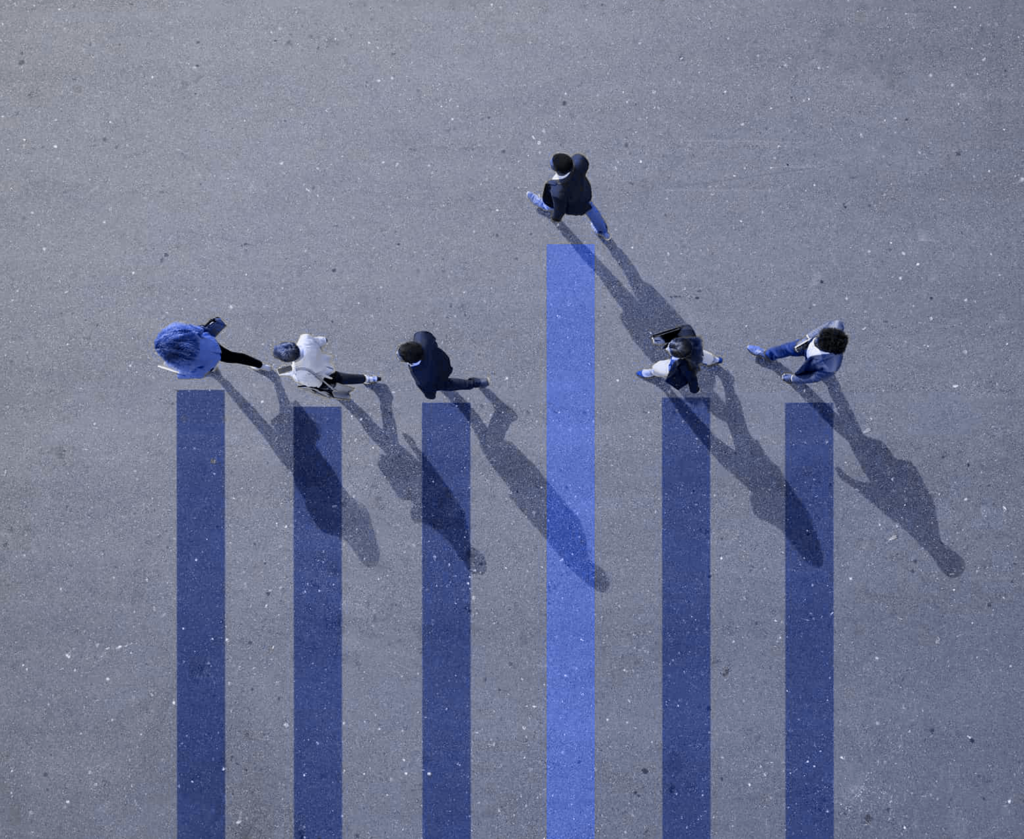 Aerial view of several people walking on blue bars simulating a growth chart.